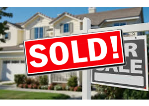 real-estate-sign-post-with-sold-sign